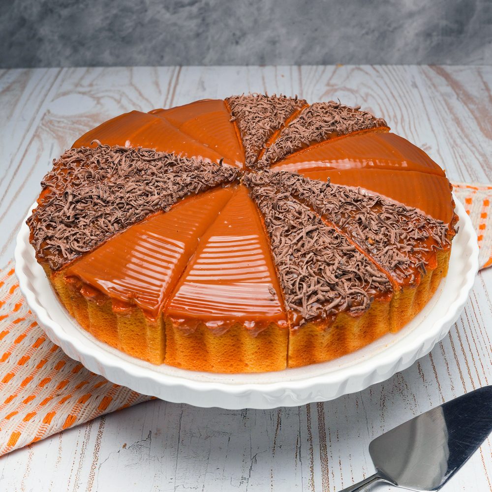 Cheese cake decorado con arequipe, chocolate o maní